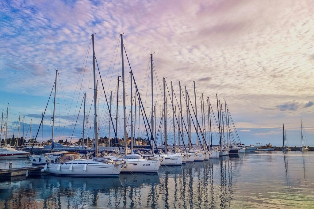 marina, sailboats, harbor, nature, sunset, yachts, sea, sailing, nautical, boats, dock, reflections, peaceful, coastal, ocean view, travel, summer, vacation, maritime, sky, tranquil, water, evening light, mooring, sailboat mast, leisure
